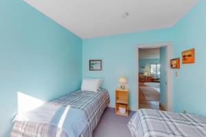 Ένα ή περισσότερα κρεβάτια σε δωμάτιο στο Lobster Cove Cottage