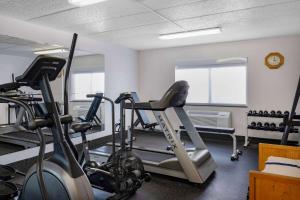 a gym with two exercise bikes in a room at AmericInn by Wyndham Aberdeen Event Center in Aberdeen