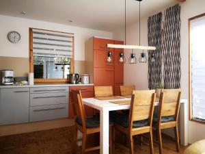 Kuchyň nebo kuchyňský kout v ubytování Ferienhaus DANA