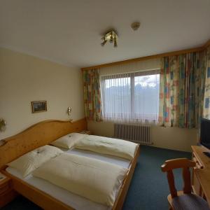 Postel nebo postele na pokoji v ubytování Hotel Pension Berghof
