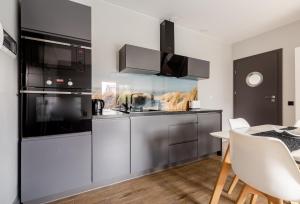 Kuchyňa alebo kuchynka v ubytovaní Martinus Apartments