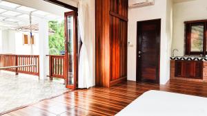 Postel nebo postele na pokoji v ubytování Baan Bhuwann Holiday Apartment