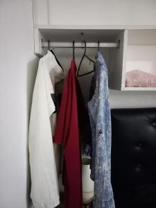 a closet with clothes hanging on a rack at Rinconada 3 in Las Grutas