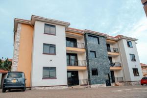 a car parked in front of a building at Broadbills Haven apartment in Kampala