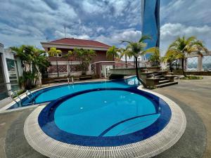 a large swimming pool in front of a building at Casa Mutiara Apartments by Moonlight in Kuala Lumpur