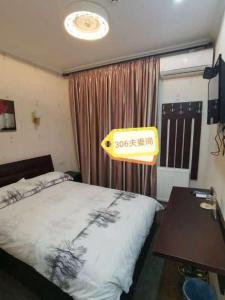 Postel nebo postele na pokoji v ubytování Great Wall hotel