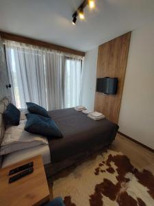 Una cama o camas en una habitación de Apartman Milovanović