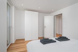 Postel nebo postele na pokoji v ubytování Moderne Neubauwohnung in Wilderswil