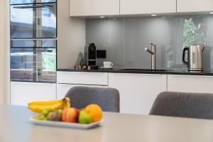 Kuchyň nebo kuchyňský kout v ubytování Moderne Neubauwohnung in Wilderswil