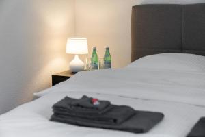 Postel nebo postele na pokoji v ubytování Moderne Neubauwohnung in Wilderswil