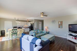 a living room with a couch and a tv at Living the Dream in Surf City