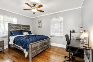 a bedroom with a bed and a ceiling fan at Stylish, Tranquil & Comfy ~ Queen Beds ~ Pkg in Detroit