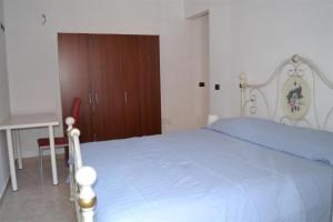 A bed or beds in a room at B&B La tarentilla
