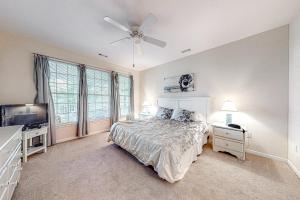 a bedroom with a bed and a ceiling fan at Bear Trap - 54 H October Glory in Ocean View