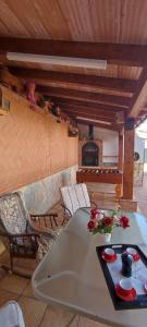 a living room with a table and a fireplace at Vivienda Turística Rural in Granada