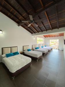 Postel nebo postele na pokoji v ubytování Hotel Casa Suite Curiti