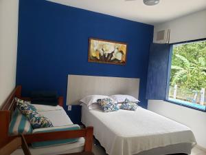 Ένα ή περισσότερα κρεβάτια σε δωμάτιο στο Pousada Rancho do André