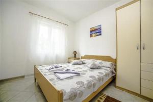 Postel nebo postele na pokoji v ubytování Apartments Bakula 1539