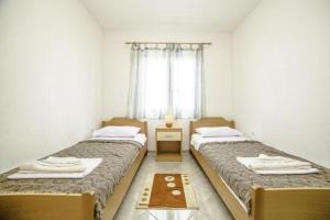 Postel nebo postele na pokoji v ubytování Apartments Bakula 1539