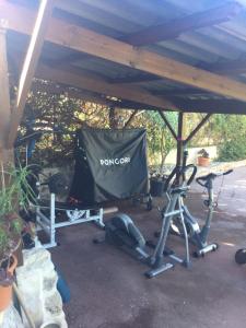 a gym with a tent and some exercise equipment at Villa ANOLPA in Vence