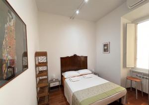 a bedroom with a bed and a ladder in it at Roma Basento in Rome