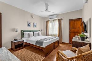 Postel nebo postele na pokoji v ubytování La Vaiencia Beach Resort, Morjim