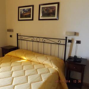 Ένα ή περισσότερα κρεβάτια σε δωμάτιο στο Corte dei Monaci