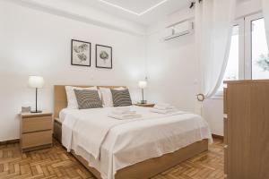 Posteľ alebo postele v izbe v ubytovaní Waterfront Glyfada
