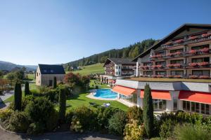 an aerial view of a resort with a swimming pool at Wellness & Genuss Resort - Engel Obertal in Baiersbronn