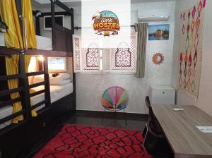 Postel nebo postele na pokoji v ubytování Stork Marrakech Luxury Hostel