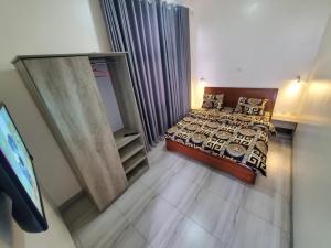 an aerial view of a bedroom with a bed at Ebenezer Hotel Apartments in Kigali