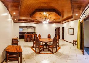 a dining room with a table and chairs at Twin House Villa in Coron