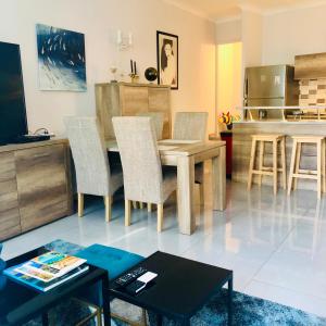 a kitchen and dining room with a table and chairs at CHARMING APARTMENT NEAR THE BEACH in Villefranche-sur-Mer