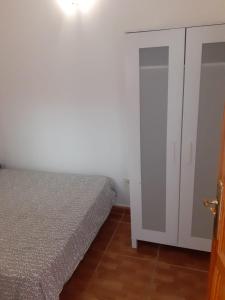 Una cama o camas en una habitación de Arguineguín Acoran street