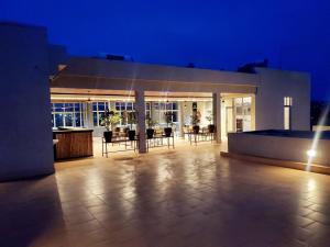 a large house with a patio at night at Ebenezer Hotel Apartments in Kigali