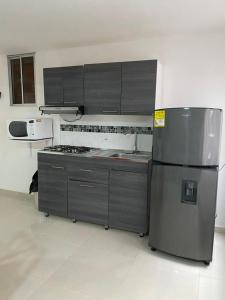 Kuchyň nebo kuchyňský kout v ubytování ApartaHotel Los Naranjos
