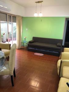 a living room with a couch and a table at King & Queen in Buenos Aires