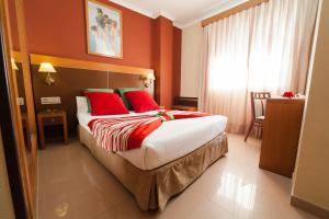 Posteľ alebo postele v izbe v ubytovaní Hotel Regio 2