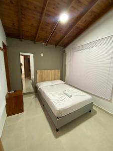 Postel nebo postele na pokoji v ubytování ApartaHotel Los Naranjos
