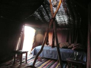 Postel nebo postele na pokoji v ubytování Dar Sidi Bounou