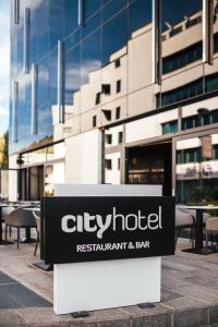 a sign for a restaurant and bar in front of a building at City Hotel Dubrovnik in Dubrovnik