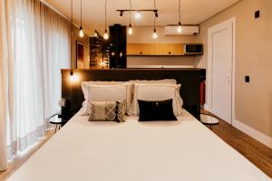 Vista Vigneti Albergo & Vino - Vale dos Vinhedos客房内的一张或多张床位