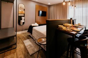 Vista Vigneti Albergo & Vino - Vale dos Vinhedos客房内的一张或多张床位