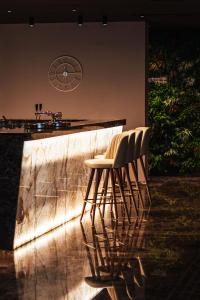 a couple of chairs sitting next to a counter at City Hotel Dubrovnik in Dubrovnik