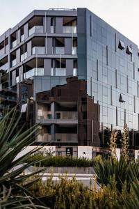 a building with a reflection of a building at City Hotel Dubrovnik in Dubrovnik
