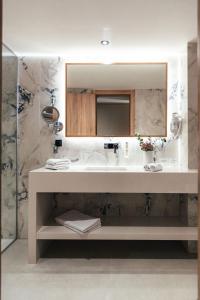 a bathroom with a sink and a mirror at City Hotel Dubrovnik in Dubrovnik