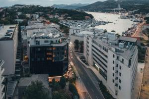 an aerial view of a city with a river and buildings at City Hotel Dubrovnik in Dubrovnik