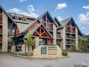 a large building with a sign in front of it at Outstanding Mountain Condo *WATERSLIDE* HOTTUB* hosted by Fenwick Vacation Rentals in Canmore