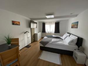Postel nebo postele na pokoji v ubytování Apartment Q im Zentrum von Königsbronn