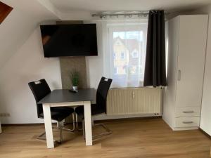 TV a/nebo společenská místnost v ubytování Apartment Q im Zentrum von Königsbronn